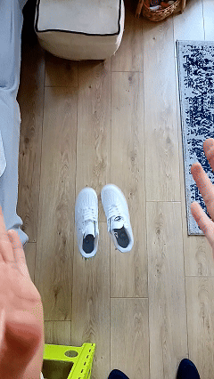 Football boots and shoes being deodorised inside Sneakertizer™, with floral scent visibly released, showing fresh, clean results.