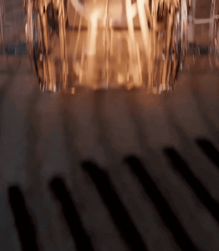 Football boots and shoes being deodorised inside Sneakertizer™, with floral scent visibly released, showing fresh, clean results.